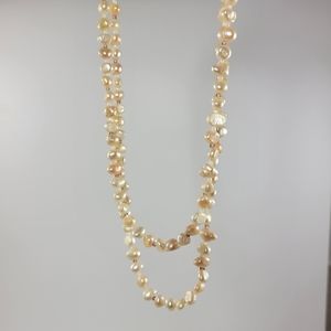 New. Fresh water pearls. Pink cream color. 18" /9" long.